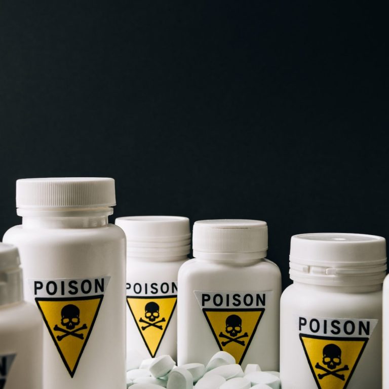 White bottles labeled "POISON" with warning symbols against a dark background.